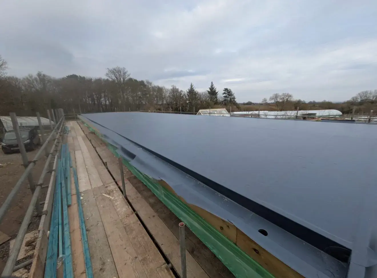 Single ply membrane across a long domestic flat roof