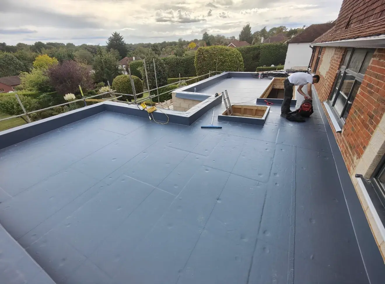 Single ply membrane being installed on a domestic flat roof